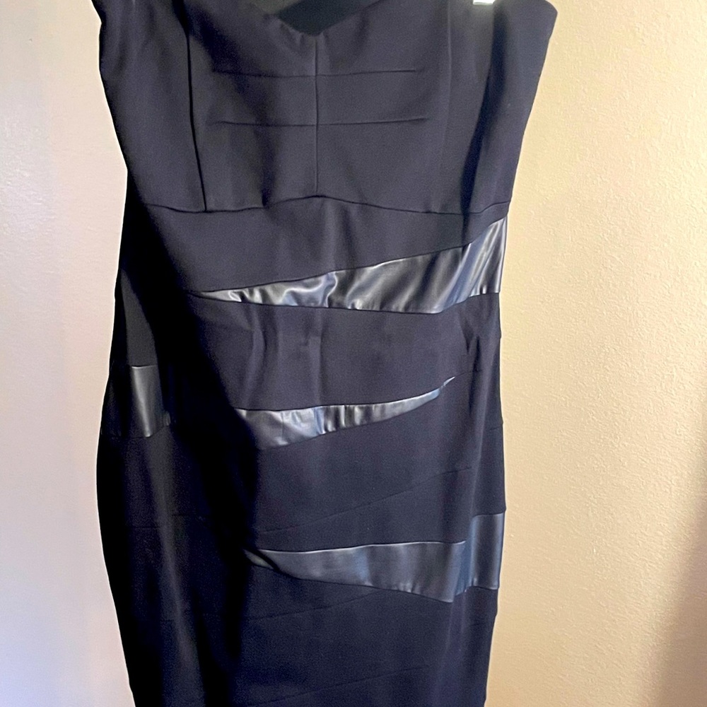 Black bodycom strapless dress. With soft leather like material on front. NWT.